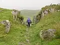 Pathway carved through rocks near summit