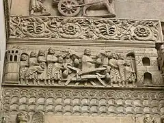 Bas reliefs on the west front: Saint Domninus saves a woman from a collapsed bridge