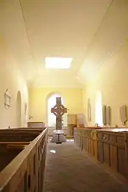High Cross and church interior