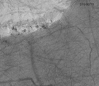 Pattern of large and small tracks made by giant dust devils as seen by Mars Global Surveyor.