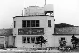 The building at Dutch Harbour airport was used as a communication room and terminal with the old U.S. Navy Aero Unit insignia in August 1972