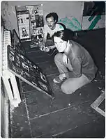 Timur Novikov (in the foreground) and (E-E) Evgenij Kozlov in the Gallery „ASSA“ in 1984. Photographer unknown.