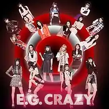 19 Japanese women (E-girls) all placed in random areas in front, and behind, white and red neon-lit circles. The title "E.G. Crazy" is placed at the bottom, which is tinted pink.
