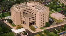 An aerial photo of a concrete brutalist building