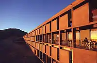 South West facade of the hotel at dusk.