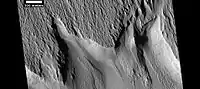 Surface features along a scarp in Memnonia quadrangle (HiRISE)