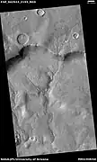 Channel system that travels through part of a crater, as seen by HiRISE under HiWish program