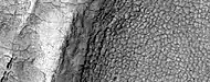 High-center polygons, as seen by HiRISE under HiWish program Image is of the top of a debris apron in Deuteronilus Mensae.