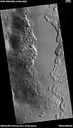 Wide view of part of Milankovic Crater, as seen by HiRISE under HiWish program.  Many depressions here contain ice in their walls.