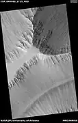 Wide view of layers in Louros Valles, as seen by HiRISE under HiWish program  Louros Valles is part of the Ius Chasma.