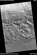 Wide view of surface with spots displaying mantle, as seen by HiRISE under HiWish program