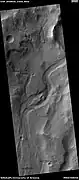 Channel, as seen by HiRISE under HiWish program  Streamlined shapes are indicated with arrows.  Location is the Phaethontis quadrangle.