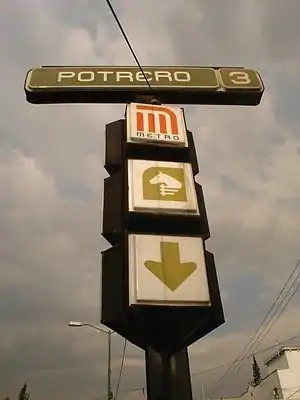 Picture of a standing sign indicating the entrance.