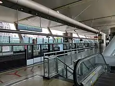 Dover MRT station with two platforms in use. The station is an infill station built along an existing line, and thus, it takes a side platform structure.