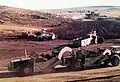 Earth moving equipment dumping fill from the borrow pits for the wall of Sterkfontein Dam. August 1972.