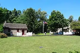 Courtyard view of the Smalleytown Schoolhouse and the Six Mile Run House