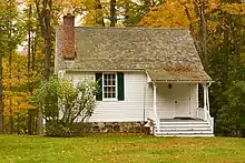 Photograph of the East Middle Patent Schoolhouse on a partly cloudy day in the Fall