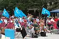 Uyghurs holding the flag in an event