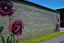 A quote from Imani Olear painted on the Charles Street Settlement House as part of the "Her Voice Carries" art installation.