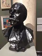 Black bust of white man with large moustache