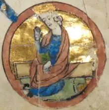  A circular medieval miniature, showing a man in blue robes, with long flowing hair and a short beard.