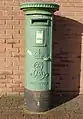 Green painted Edward VII pillar box at Rosslare Harbour