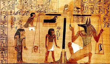 The Papyrus of Ani is a version of the Book of the Dead for the Scribe Ani. This vignette (small scene that illustrates the text) is Chapter for not letting Ani's heart create opposition against him in the God's Domain.