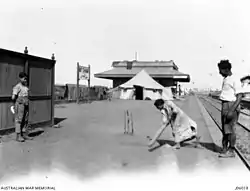 Old photo of children and their father playing cricket at Mit Ghamr Railway station. The father lost his leg whilst working with the Egyptian labour corps in Sinai.