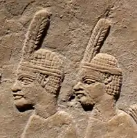 Nubian prisoners.They wear the typical one-feathered headgear of Taharqua's soldiers.