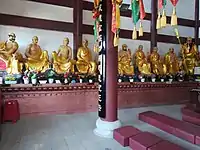 Statues of Eighteen Arhats at Lingsheng Temple in Hunan, China.