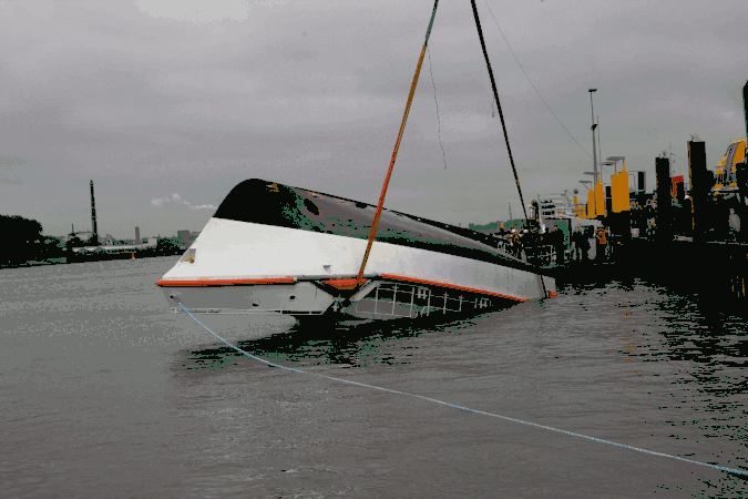 A larger self-righting vessel's stability test. Note large deckhouse, which is almost the only part submerged when fully inverted.