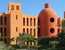 In the architectural design of Steigenberger Hotel in El Gouna Egypt, the minimalist design with 3-D geometric composition, and monochromatic coloring scheme provides graphical compositions from various angles