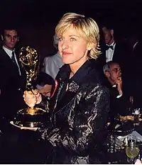 A photograph of Ellen DeGeneres with her 1997 Emmy Award.