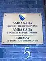 Plaque outside the embassy in Bosnian, English and Serbian depicting the Coat of arms of Bosnia and Herzegovina