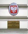 Plaques outside the embassy, one depicting the Coat of arms of Poland, the other in English and Polish