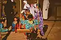 Emirati children playing while wearing traditional dresses