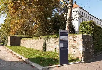 South Emona's wall with information panel. This location is one of the spots on a 2 km (1 mi) footpath, connecting the locations of ten ancient sites in present-day Ljubljana. Suggested starting point: City Museum of Ljubljana.