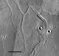 Middle portion of Enipeus Vallis. The valley divides into several channels, forming large central island at 37.0°N, 267.2°E. Image is THEMIS VIS mosaic.