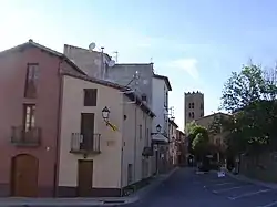 Entrance to old village of Seva., with St. Mary's church behind