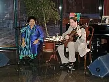 Paul C. Pieper (right) performing with Ericka Ovette at a 2004 concert in Estonia.