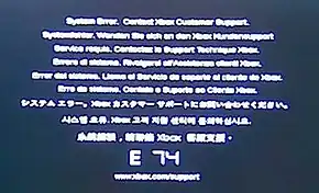 The error code E74.  Above the large E 74 code is the message "System Error. Contact Xbox Customer Support." repeated in different languages.
