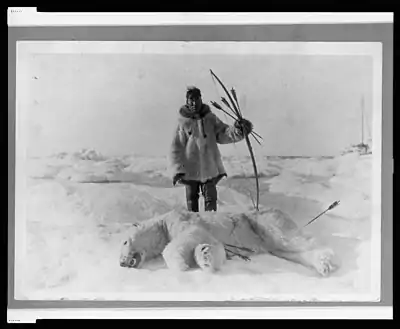 Eskimo hunter and polar bear slain with bow and arrow