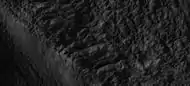 Close-up of the edge of one of the glaciers on the bottom of the wide view from a previous image  Picture was taken by HiRISE under the HiWish program.