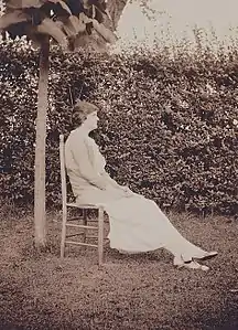 Esther Murphy Arthur sitting outside on a chair, 1923
