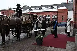 The King and Queen of Sweden with the President of Estonia, Toomas Hendrik Ilves, and his wife Evelin Ilves at the Royal Stables, entering the State Coach (2011).