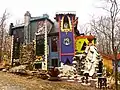 Facade of Luna Parc built of wood, rock, concrete, and ceramic mosaics