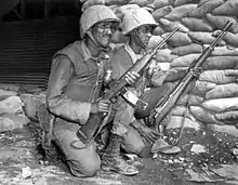 Ethiopian soldiers deployed with U.S.-made weapons in Korea, 1953. The M1 Carbine magazines are taped together.