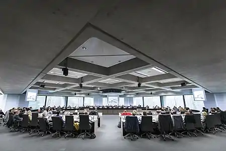 A large conference room with a two circular rows at the European Investment Bank headquarters in Luxembourg