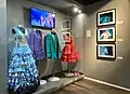 Glass display with dresses and jackets from the Eurovision Song Contest.