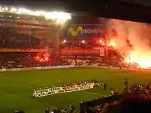 Teams line up for Basques v Catalans match with political banners and flares (2007)